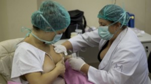 A mother donates milk at the Fernandes Figueira Institute in Rio de Janeiro, Brazil. (AP)