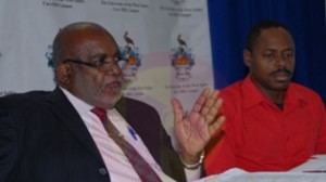 Cave Hill Campus registrar Kenneth Walters (left) speaking about enrolment numbers as senior assistant registrar for student affairs Rommel Carter looks on during yesterday’s news conference. (Picture by Lennox Devonish.)