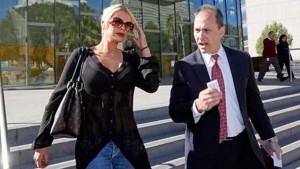 Chloe Goins (left) a model who claims entertainer Bill Cosby drugged and sexually abused her at the Playboy Mansion in 2008, leaves Los Angeles police headquarters with her attorney Spencer Kuvin after meeting with police investigators. (AP picture)