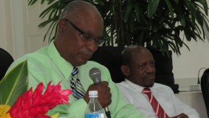 St. Kitts and Nevis' Prime Minister the Rt. Hon. Dr. Denzil L. Douglas (right) listens at the Political Leader of the Nevis Reformation Party (NRP) speaks.