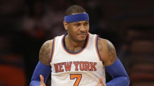 New York Knicks' Carmelo Anthony reacts during the first half of the NBA basketball game against the Los Angeles Lakers, Sunday, Feb. 1, 2015 in New York. (AP Photo/Seth Wenig) 