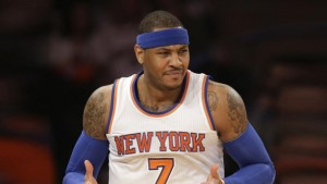 New York Knicks' Carmelo Anthony reacts during the first half of the NBA basketball game against the Los Angeles Lakers, Sunday, Feb. 1, 2015 in New York. (AP Photo/Seth Wenig)