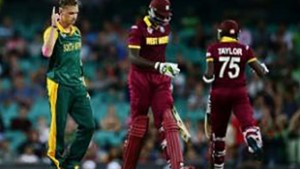 Jason Holder (second from left) walks off after being dismissed by fast bowler Dale Steyn (left) on Friday.