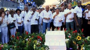 Haiti’s President His Excellency Michel Martelly (c) leads tributes to the victims of the Carnival incident