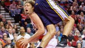 Trail Blazers center Robin Lopez (42) gets Jazz center Rudy Gobert off his feet during the fourth quarter.