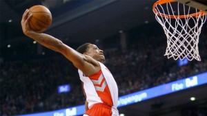 Raptors guard DeMar DeRozan goes for a dunk against the Rockets.