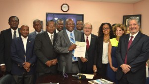 PM Harris and Ambassoador Herrera flanked by Cabinet and PetroCaribe officials