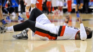Wesley Matthews injures his left Achilles tendon against the Dallas Mavericks during the second half in Portland on Thursday.