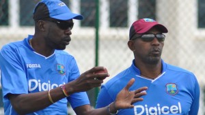 Sir Curtly Ambrose (left) chats with new coach Phil Simmons during a training session at the Sir Vivian Richards Cricket Ground earlier this week. (WICB Media) 