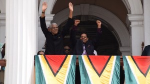 President David Granger and Prime Minister designate Moses Nagamootoo acknowledge the large gathering outside Parliament