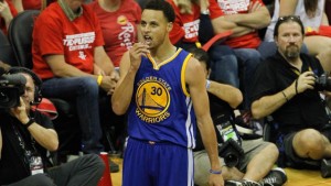 Stephen Curry stares down the crowd after drilling a corner 3. (Bob Levey/Getty Images)