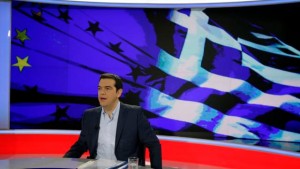 Greece's Prime Minister Alexis Tsipras prepares for a TV interview at the State Television (ERT) in Athens, Monday, June 29, 2015. Anxious pensioners swarmed closed bank branches Monday and long lines snaked at ATMs as Greeks endured the first day of serious controls on their daily economic lives ahead of a July 5 referendum that could determine whether the country has to ditch the euro currency and return to the drachma. (AP Photo/Thanassis Stavrakis) 