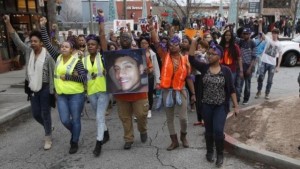 People protest over a police shooting of a naked man named Anthony Hill in Decatur, Georgia March 11, 2015. REUTERS/Tami Chappell 