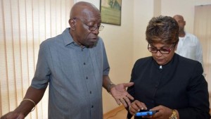 'Tip of the iceberg': Leader of the Independent Liberal Party, Jack Warner, speaks to attorney Rekha Ramjit, chairman of the party, at yesterday's news conference at the Centre of Excellence, Macoya. —Photo: ANISTO ALVES