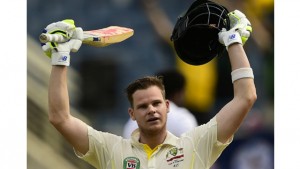 Australia's Steve Smith reacts after scoring 100 runs, on the first day of the second cricket Test between Australia and the West Indies. (Photo: AFP)