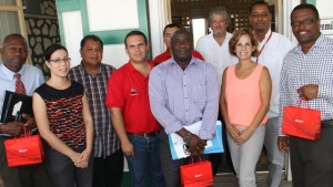 General Manager POV St. Kitts Nevis Ltd. Maria Andreina Colmenores (front row, second from right) and other members of the Venezuelan delegation led by resident Venezuelan Ambassador to St. Kitts and Nevis His Excellency Ròmulo Henriquez Gonzàlez  (back row, third from right) with Acting Premier of Nevis Hon Mark Brantley (extreme right), Minister responsible for Renewable Energy Hon. Alexis Jeffers ( front row, second from left), Acting General Manager of the Nevis Electricity Company Ltd. Jervan Swanston (extreme left) at the Nevis Island Administration office, Bath Hotel on June 04, 2015