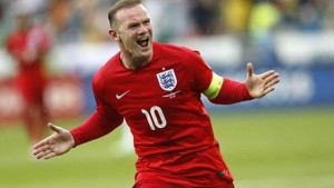 MILESTONE: England's Wayne Rooney celebrates his goal during the Euro 2016 Group E qualifying match against Slovenia, in Ljubljana, Slovenia, yesterday. --AP Photo