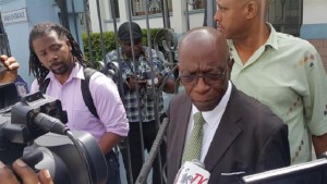 Jack Warner talks to reporters about why he’s seeking judicial review in his extradition case, after making a court appearance yesterday.