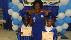  Ms. Sonia Boddie with scholarship recipients Juniqua Carey and Azamba Alexander