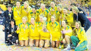 Members of Australia’s netball team celebrate with the Netball World Cup trophy at the Allphones Arena in Sydney, Australia, yesterday. Australia defeated New Zealand 58-55.