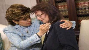 Attorney Gloria Allred comforts Linda Ridgeway Whitedeer, a former actress, as she speaks about her alleged assault by Bill Cosby during a news conference with new accusers against comedian Bill Cosby at attorney Gloria Allred's office in Los Angeles, California August 12, 2015. REUTERS/Patrick T. Fallon
