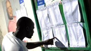 A man looks at the rolls a polling station during the Legislative Elections in Port-au-Prince, Haiti.(Photo: AFP) 