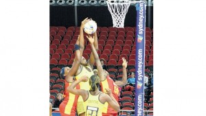 Jamaica goal-shooter Jhaniele Fowler-Reid (centre) comes under pressure from Uganda’s Betty Namukasa (left) and Florence Nanyonga as Jamaica’s Anna-Kaye Griffiths looks on.