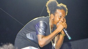 Popcaan interacting with patrons.