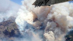 Smoke rising from the TePee Springs fire in the Payette National Forest is seen in an aerial picture taken by the McCall Smokejumpers near Riggins, Idaho August 17, 2015. REUTERS/US Forest Service/McCall Smokejumpers/Handout