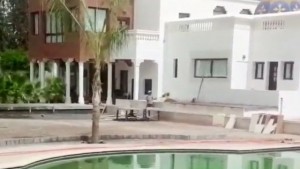 The video showed workmen sweeping up by the pool