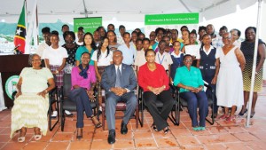 New scholarship awardees, Fifth Form Graduates, parents, and Social Security officials pose for a group picture. Seated are, from left: Ms Susanna Lee, Ms Claudine Saunders, the Hon Vance Amory, Ms Maritza Bowry, and Mrs Sephlin Lawrence.