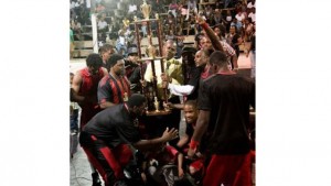 Deputy Prime Minister Hon. Shawn K. Richards flanked by new SKNABA Champions the St.Pauls Tuff Knots after presenting them with the brand new 4 ft Championship Trophy