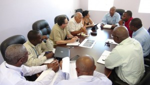 At the head table is Consultant to the NIA Michael Perkins, to his right is Project Coordinator Luz Maria Guerra Brito and Consultant Engineer of International Airport Development Ltd. Leonardo Perez, Consultant at ARC Associates Inc. Daniel Casal, Acting Manager of the Vance W. Amory International Airport Daron Sutton, General Manager of Nevis Air and Sea Ports Authority Oral Brandy, Permanent Secretary in the Ministry of Tourism Carl Williams, Permanent Secretary in the Ministry of Communication and Works Ernie Stapleton, Director at the Nevis Disaster Management Department Brian Dyer and Director of Sales and Marketing at the Nevis Tourism Authority Devon Liburd in discussions at the Ministry of Communications and Works conference room on September 30, 2015