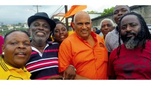 Businessman Peter Blake (centre) is congratulated by supporters, among them Councillor Oliver Clue (second left), after his victory in yesterday’s selection exercise to determine the PNP’s general election candidate for St Andrew East Rural. The selection was held at PNP headquarters on Old Hope Road, St Andrew