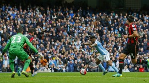 Manchester City's English midfielder Raheem Sterling (2nd R) prepares to shoot and score his third goal of the English Premier League football match between Manchester City and Bournemouth on Saturday. 