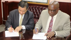 Dr. the Honourable Timothy Harris (right), Prime Minister of St. Kitts and Nevis and His Excellency George Gow Wei Chiou (left), Taiwan's Resident Ambassador to St. Kitts and Nevis during the handing over of cheques on Monday, October 12. 