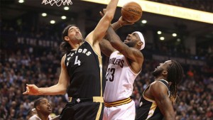 LeBron James, who scored 24, is fouled by the Raptors' Luis Scola.