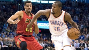 Kevin Durant goes for 25 points, 12 rebounds and 10 assists against Thabo Sefolosha and the Hawks in Oklahoma City on Thursday.
