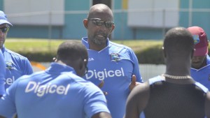 Coach Phil Simmons chats with his troops during a training session in Australia