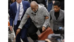 Actor and comedian Bill Cosby (C) arrives with attorney Monique Pressley (R) for his arraignment on sexual assault charges at the Montgomery County Courthouse in Elkins Park, Pennsylvania December 30, 2015.