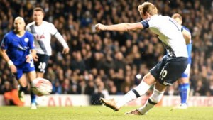 Tottenham Hotspur’s English striker Harry Kane shoots to score a penalty against Leicester City in their FA Cup match at White Hart Lane in north London, yesterday. The game ended 2-2.