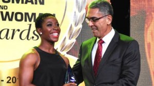 Sagicor Group President and CEO Richard Byles presents Shelly-Ann Fraser-Pryce with the Sagicor Iconic Award at the RJR National Sportsman and Sportswoman Awards ceremony at the Jamaica Pegasus Hotel on Friday.