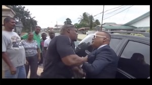 A screenshot from the video showing the altercation between Ian Alleyne (right) and Inspector Roger Alexander.