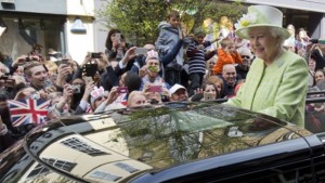 Britain's Queen Elizabeth II greets wellwishers during a 'walkabout' on her 90th birthday in Windsor, west of London today.