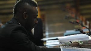 Jamaica and West Indies cricketer André Russell makes a note during a recent Jamaica Anti-Doping Disciplinary Panel hearing at the Jamaica Conference Centre in Kingston.