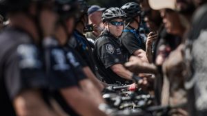 Police surround demonstrators outside of Bank of America Stadium before an NFL football game between the Charlotte Panthers and the Minnesota Vikings September 25, 2016 in Charlotte, North Carolina. Protests have disrupted the city since Tuesday night following the shooting of 43-year-old Keith Lamont Scott at an apartment complex near UNC Charlotte.