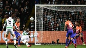 Manchester City's goalkeeper Claudio Bravo (2R) watches as Celtic's striker Moussa Dembele (3L) scores his team's third goal during the UEFA Champions League football match.