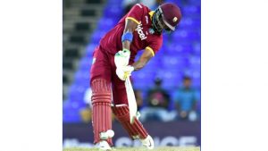 West Indies cricketer Darren Bravo hits a boundary off Australian bowler Adam Zampa during their One-Day International match of the Tri-nation Series at the Warner Park stadium in Basseterre, Saint Kitts, on Monday. West Indies won by four wickets