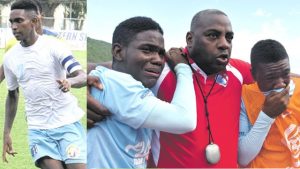 Dominic James in action for his team St George’s College & St George’s College team manager Michael Gordon (centre) supports two members of the team as they all mourn the passing of Dominic James yesterday at Stadium East during a Manning Cup match against Excelsior High