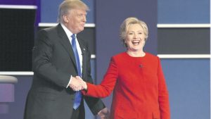Democratic nominee Hillary Clinton (R) shakes hands with Republican nominee Donald Trump after the first presidential debate at Hofstra University in Hempstead, New York on Monday.